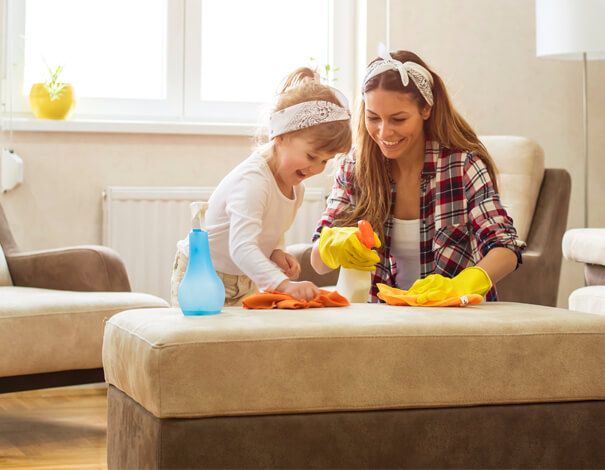 Woman and daughter cleaning house