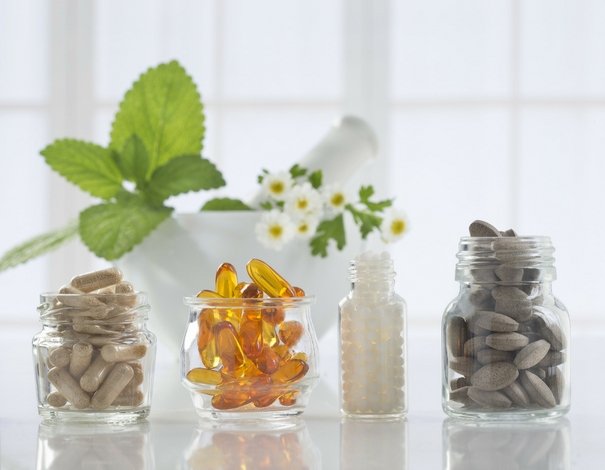 glass jars with supplements and vitamins
