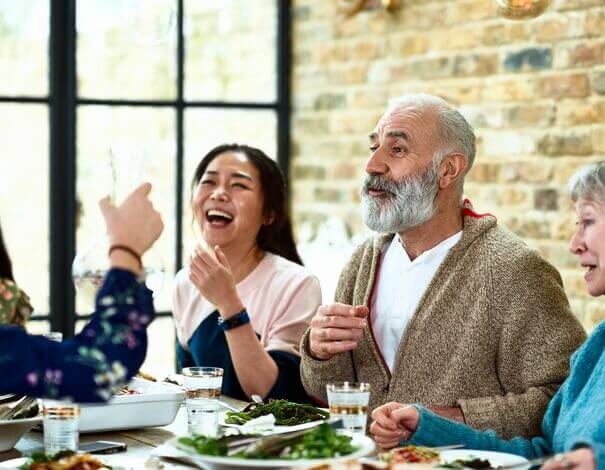 Happy family having a discussion at the dinner table