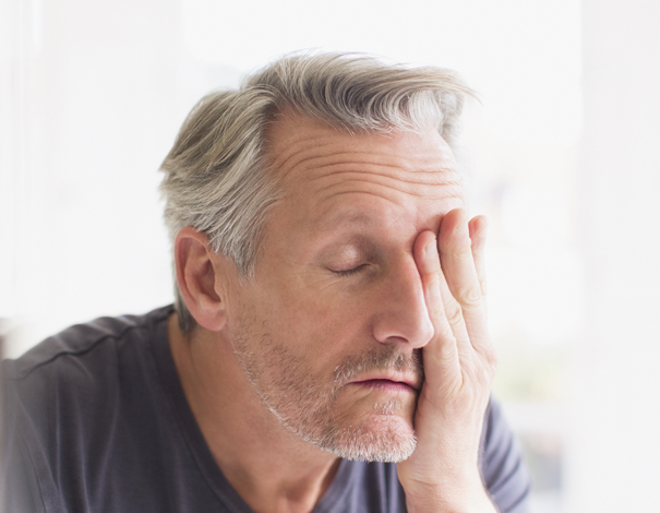 Man touching his face