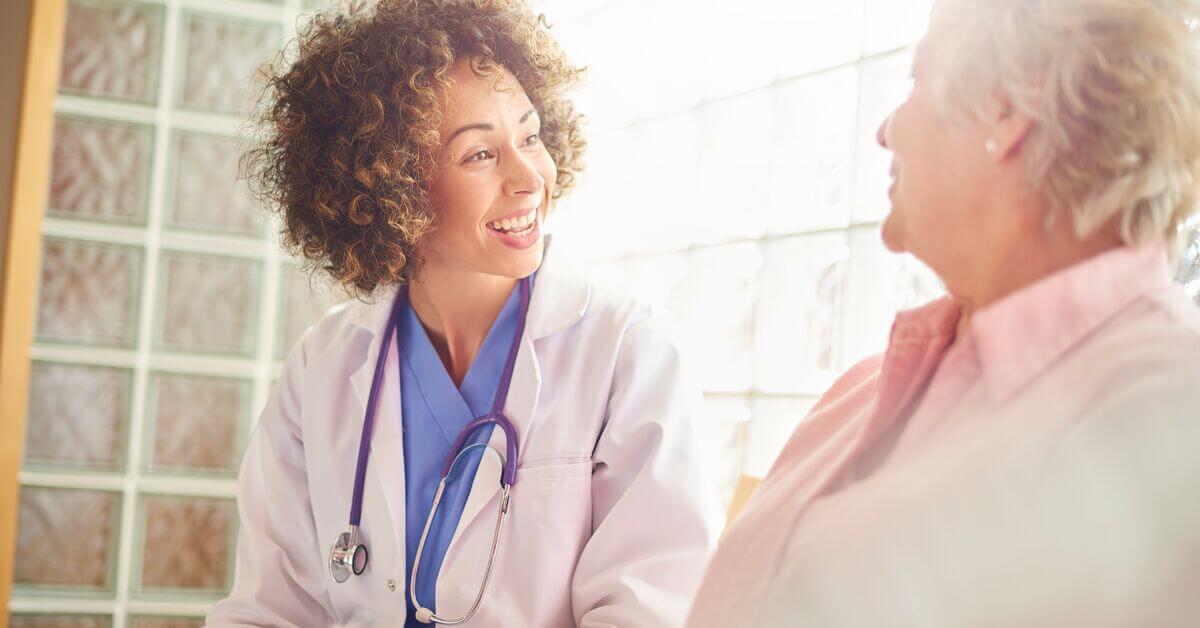 woman pharmacist with patient